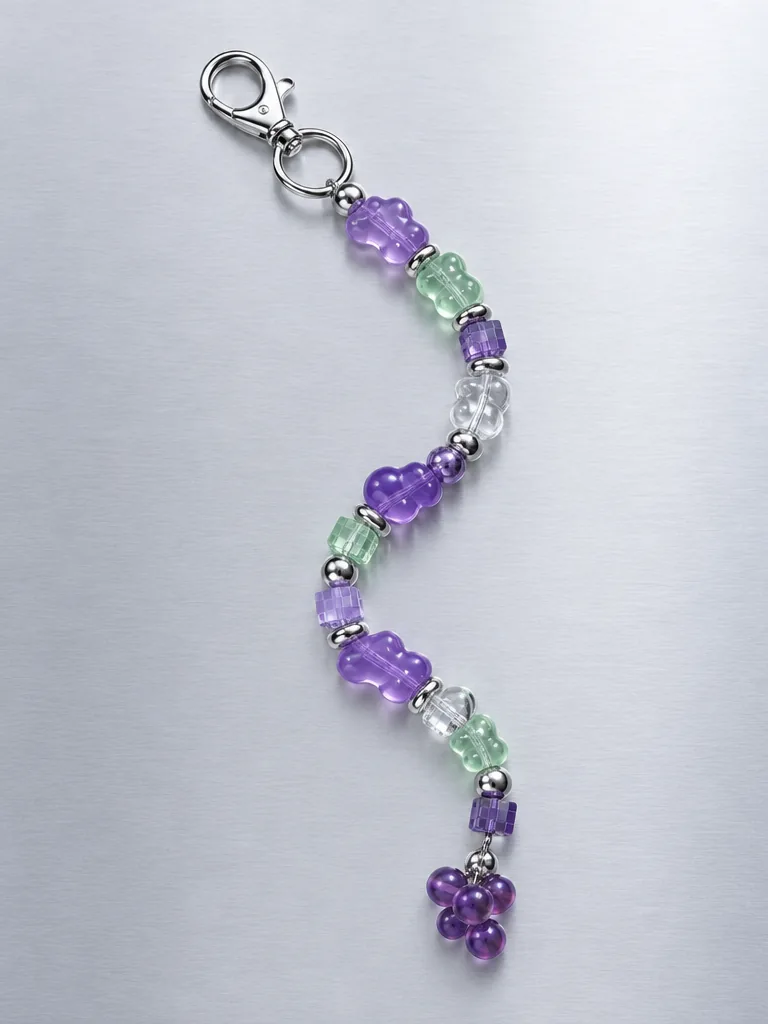 Grape Soda Earbud Case Charm, laid flat