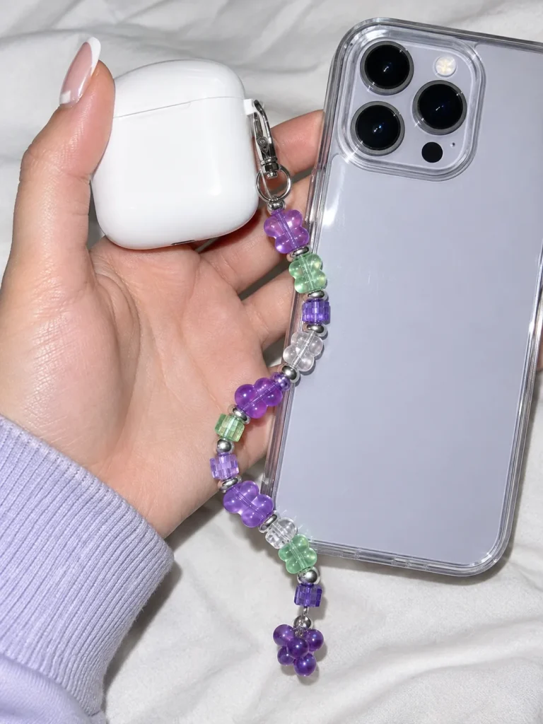 Grape Soda Earbud Case Charm worn or in use
