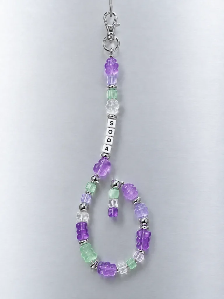 Grape Soda Pixel Strand hanging from its clasp