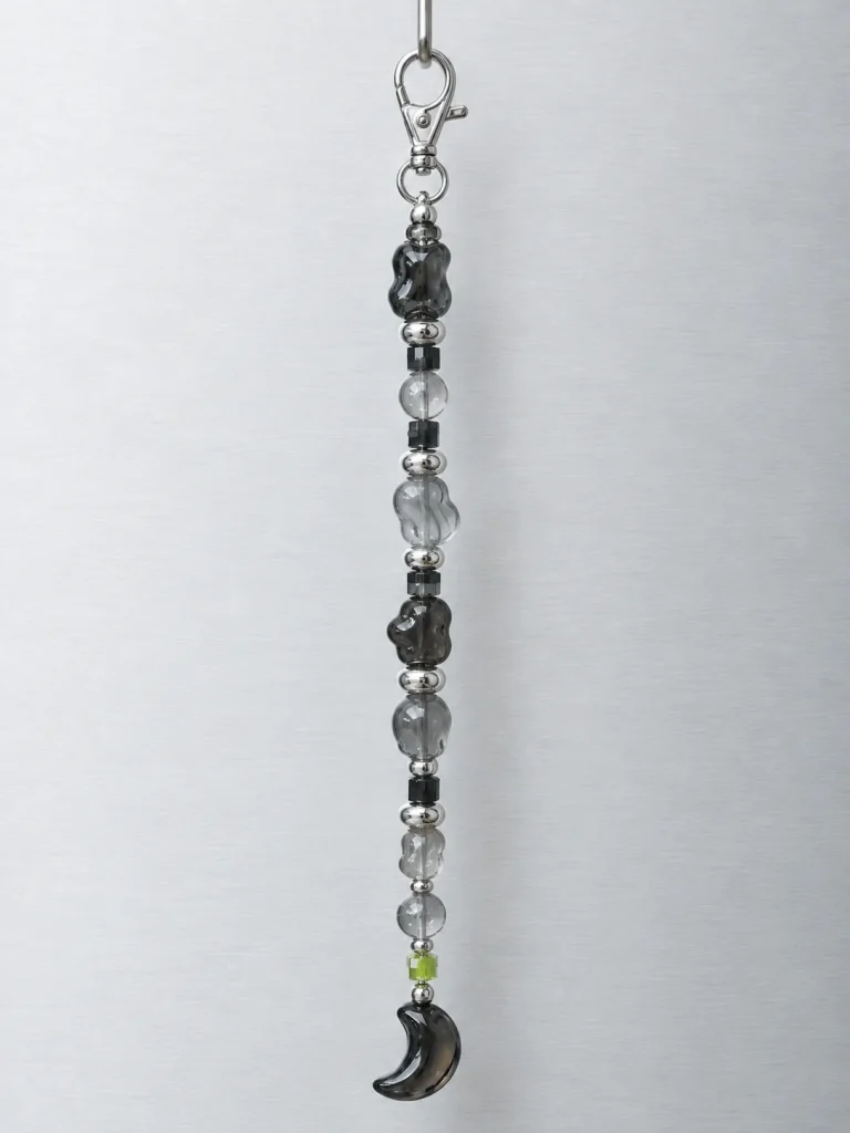 Night Mode Bag Dangle hanging from its clasp