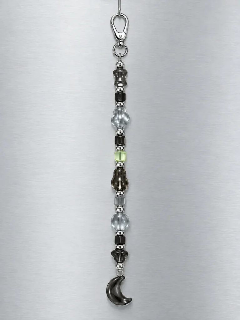 Night Mode Drop Charm hanging from its clasp