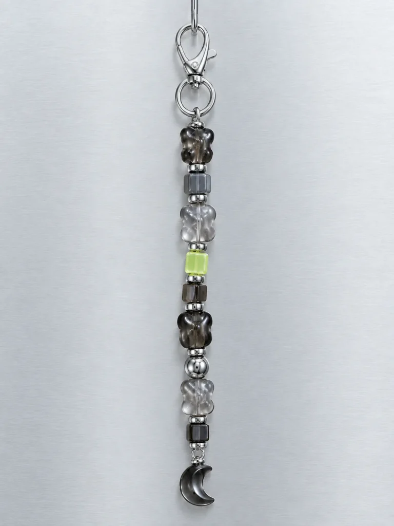 Night Mode Earbud Case Charm hanging from its clasp