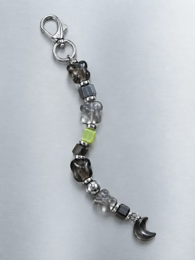 Night Mode Earbud Case Charm, laid flat