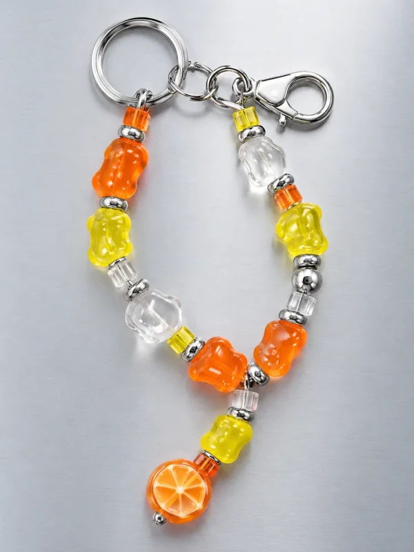 Tangerine Glitch Bag Dangle, laid flat