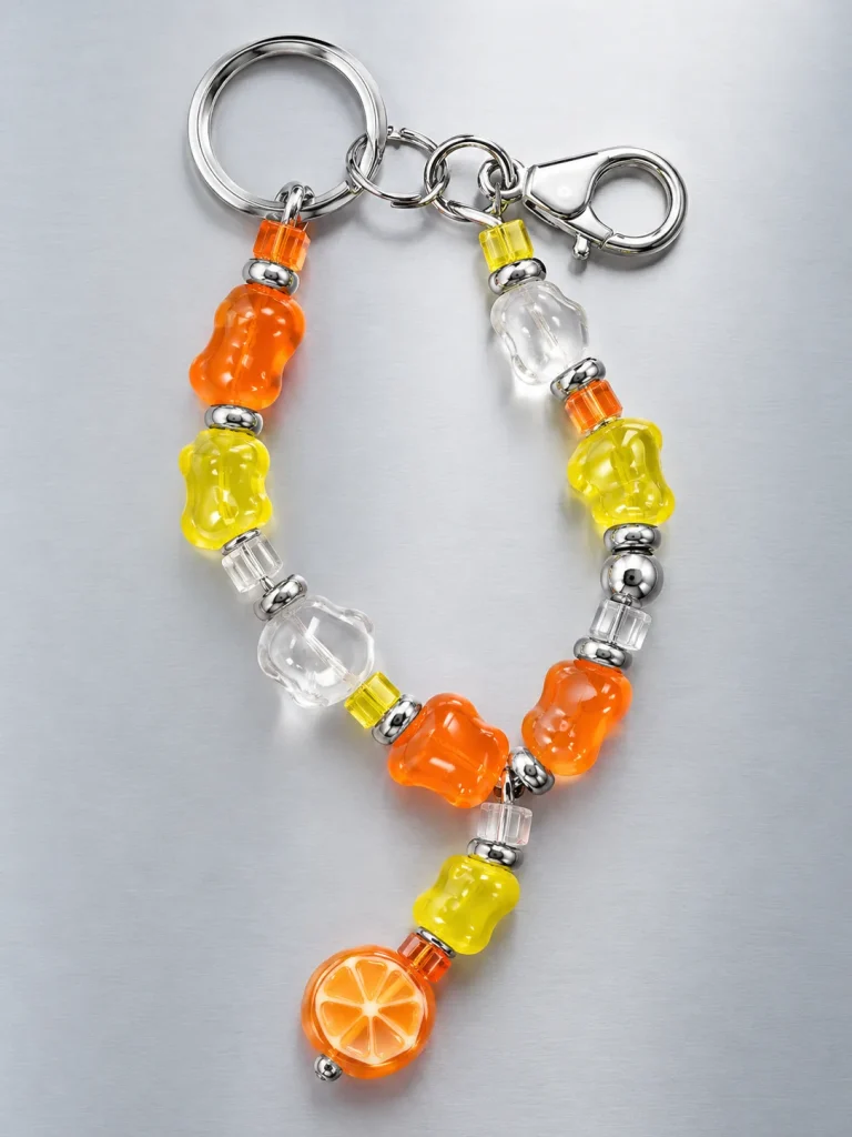 Tangerine Glitch Bag Dangle, laid flat