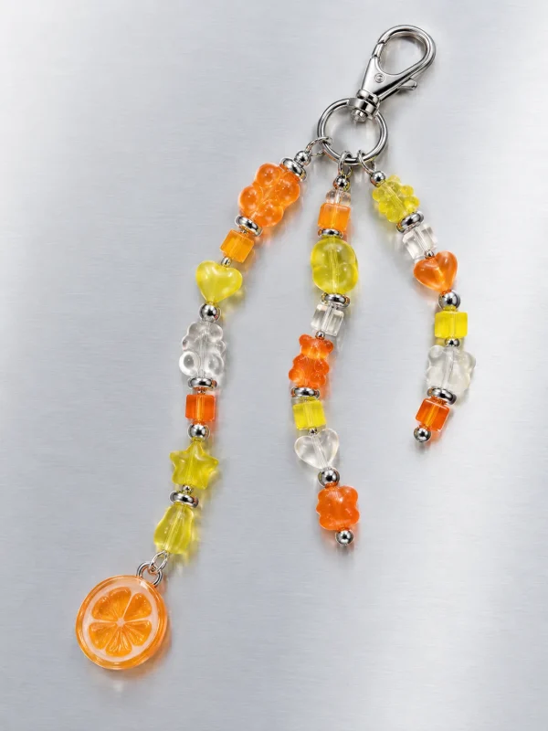 Tangerine Glitch Cluster Charm, laid flat