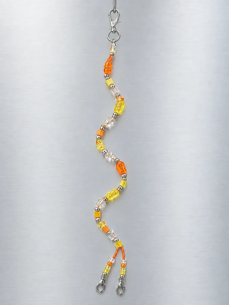 Tangerine Glitch Crossbody Lanyard hanging from its clasp