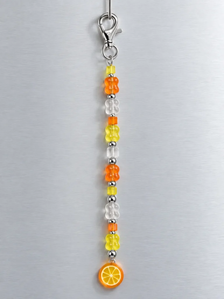 Tangerine Glitch Drop Charm hanging from its clasp