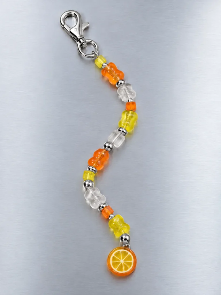Tangerine Glitch Drop Charm, laid flat