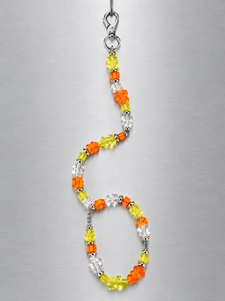 Tangerine Glitch Short Lanyard hanging from its clasp